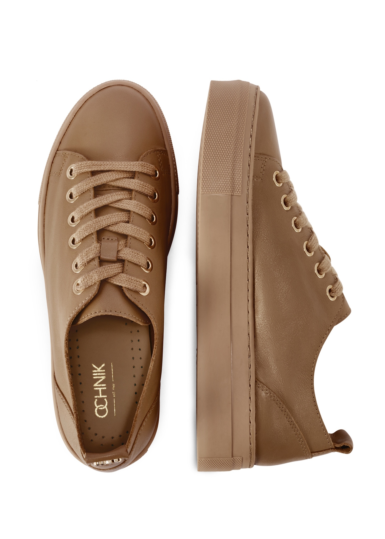 Dámske kožené tenisky v chladnej béžovej farbe BUTYD-1062-1K(W26), pohľad na produkt zhora na bielom pozadí.