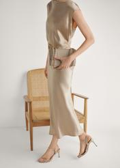 Dámske zlaté sandále na vysokom podpätku BUTYD-1233-2X(W26), bočný pohľad na produkt na nohách modelky.