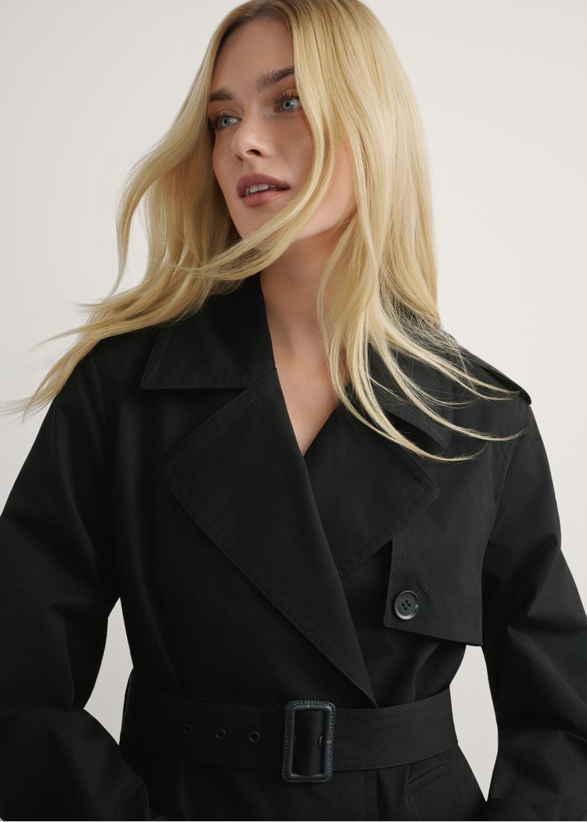 Dlhá čierna dámska bunda v podobe kabáta KURDT-0512-99(W25)